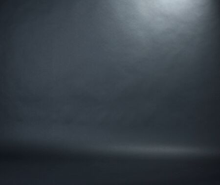 Spotlight studio interior, black background Spotlight studio interior, black background