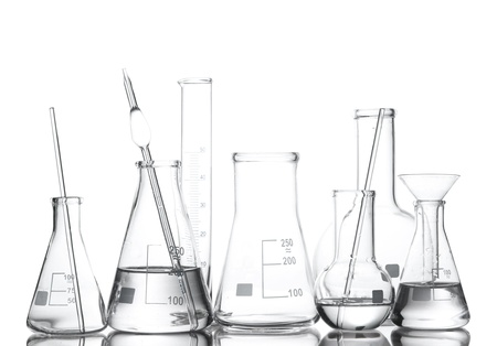 Different laboratory glassware with water and empty with reflection isolated on white