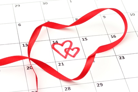 Calendar page with hearts and ribbon on St.Valentines Dayの写真素材