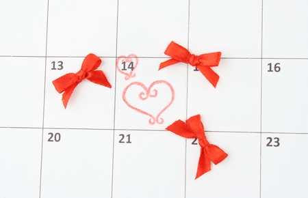 Calendar page with hearts and bows on St.Valentines Dayの写真素材