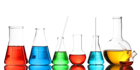 Different laboratory glassware with color liquid and with reflection isolated on whiteの写真素材