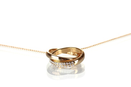 Pendant in form of rings with gem isolated on whiteの写真素材