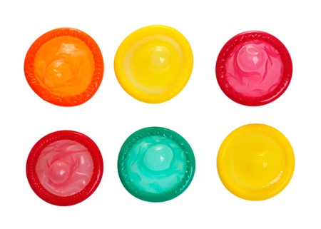 Colorful condoms isolated on whiteの写真素材