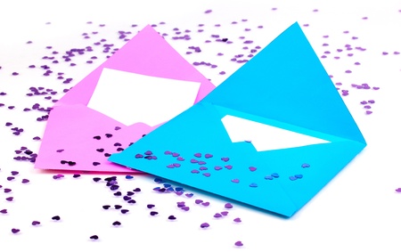 Color envelopes and confetti isolated on white