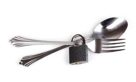 Fork and spoon with padlock isolated on white