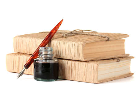old books, ink pen and ink bottle isolated on whiteの写真素材