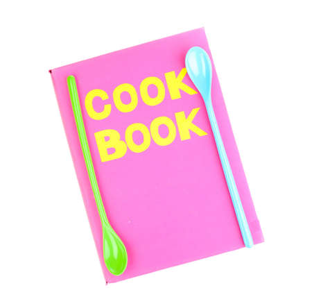 Pink cookbook and kitchenware isolated on whiteの写真素材
