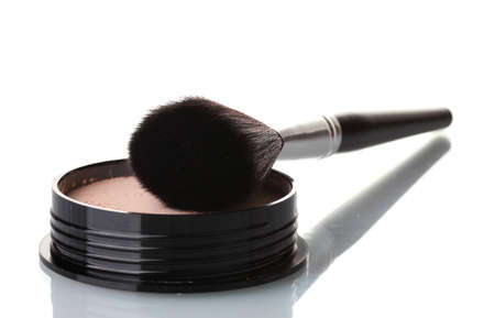 closeup of face powder and brush isolated on whiteの写真素材