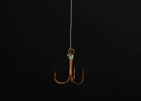 Treble fish hook isolated on blackの写真素材
