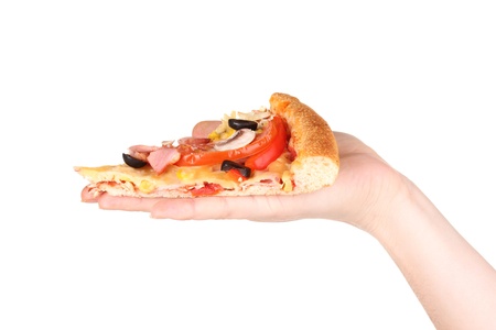 Slice of tasty pizza in hand close-up isolated on whiteの写真素材