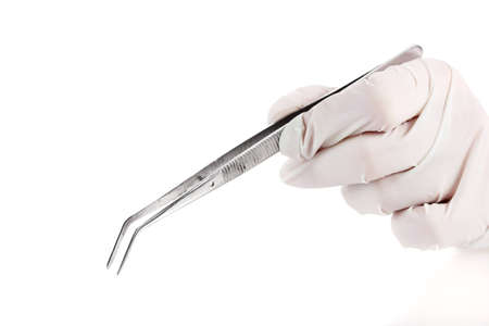 Medical tweezers in hand isolated on white