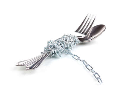 Fork and spoon with chain isolated on white