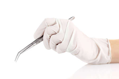 Medical tweezers in hand isolated on whiteの写真素材