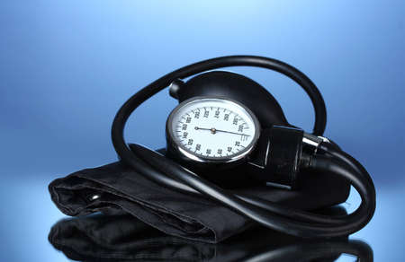 Black tonometer on blue background