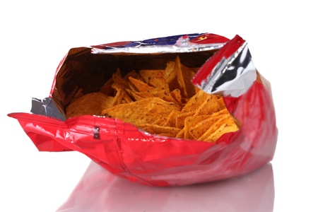 tasty potato chips in bag isolated on white