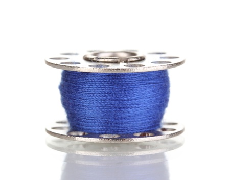 Metal spool of thread isolated on whiteの写真素材
