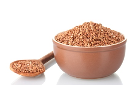 Raw buckwheat isolated on whiteの写真素材