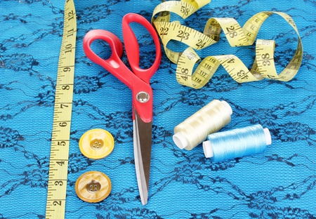 Sewing accessories on fabric
