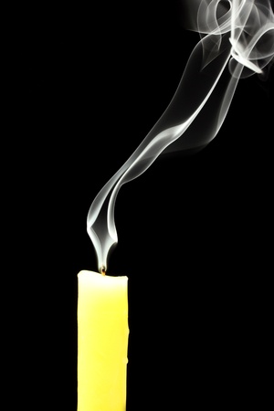 candle with abstract smoke on black backgroundの写真素材