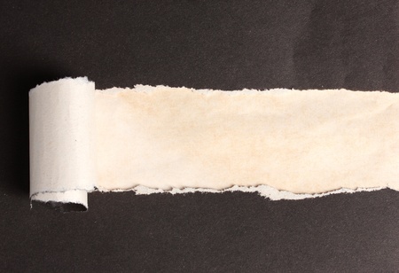 Torn black paper  with brown background