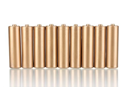 golden batteries isolated on white