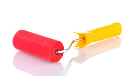 bright paint roller isolated on whiteの写真素材