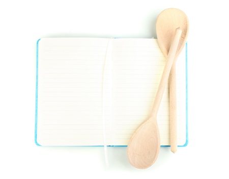 Open cookbook and kitchenware isolated on whiteの写真素材