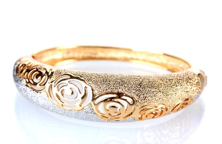Beautiful golden bracelet  isolated on whiteの写真素材