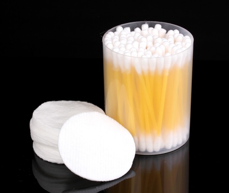 Cotton swabs and sticks isolated on black
