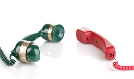 Handsets of old and modern phones isolated on whiteの写真素材