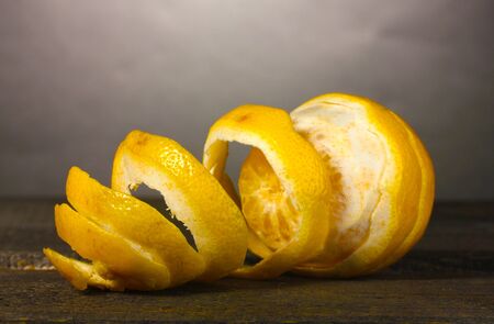 ripe lemons on wooden table on grey backgroundの写真素材