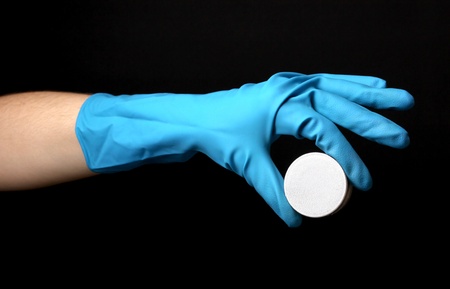 Uranium in hand isolated on blackの写真素材