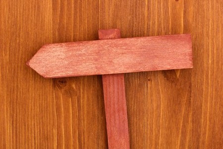 Color wooden sign board on wooden backgroundの写真素材