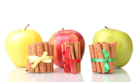 Cinnamon sticks and apples isolated on whiteの写真素材