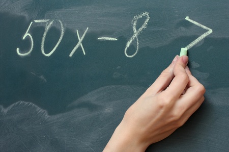 Hand writing mathematical test on the blackboardの写真素材