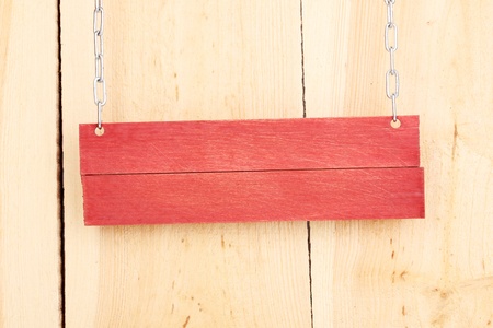 Color wooden sign board on wooden backgroundの写真素材