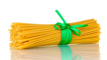 Bunch of spaghetti with ribbon isolated on whiteの写真素材