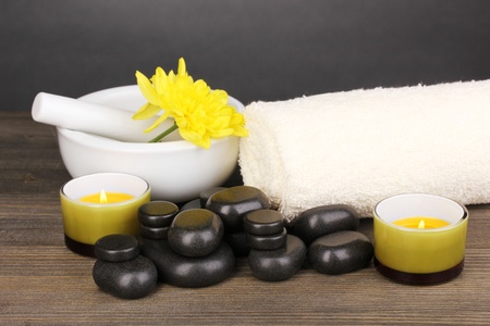 Spa setting on wooden table on grey backgroundの写真素材