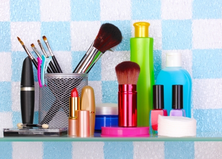 Shelf with cosmetics and toiletries in bathroomの写真素材