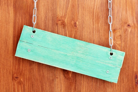 Color wooden sign board on wooden backgroundの写真素材