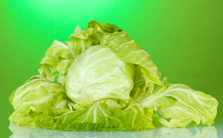Cabbage on bright green backgroundの写真素材
