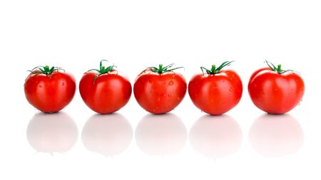 Fresh tomatoes isolated on whiteの写真素材