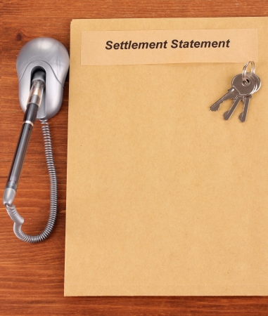 folder with information on real estate on wooden background close-upの写真素材