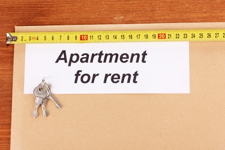 folder with information on apartments for rent on wooden background close-upの写真素材