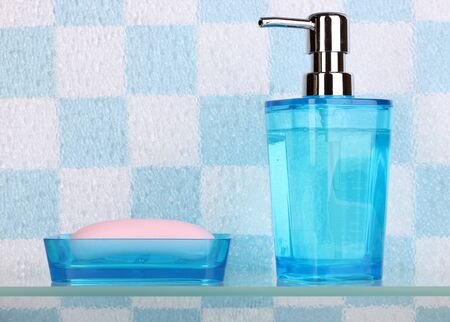 Bath accessories on shelf in bathroomの写真素材