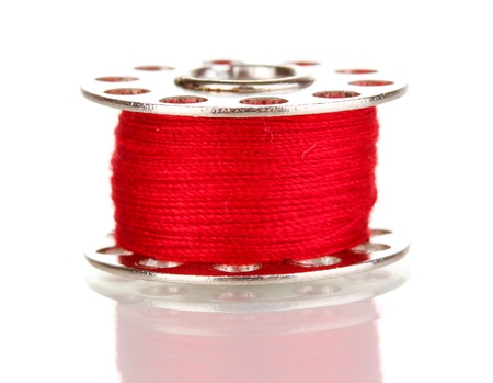 Metal spool of thread isolated on whiteの写真素材