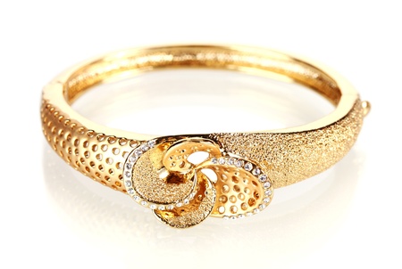Beautiful golden bracelet with precious stones isolated on white
