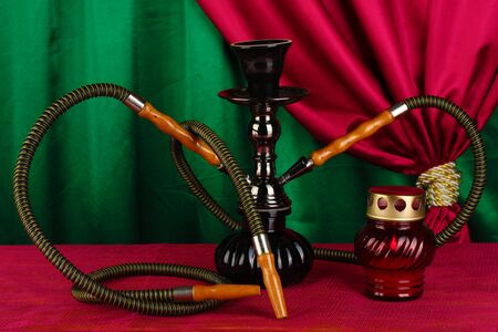 hookah on a wooden table on a background of curtain close-upの写真素材