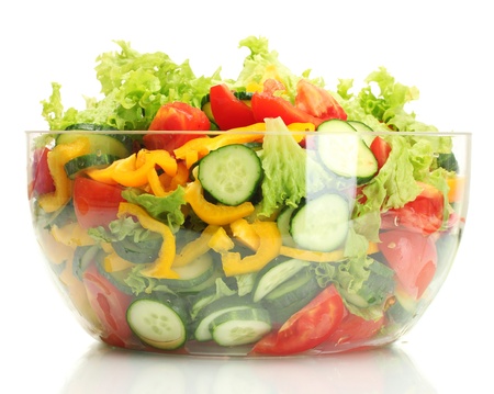 fresh vegetable salad in transparent bowl isolated on whiteの写真素材