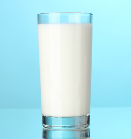 Glass of milk on blueの写真素材